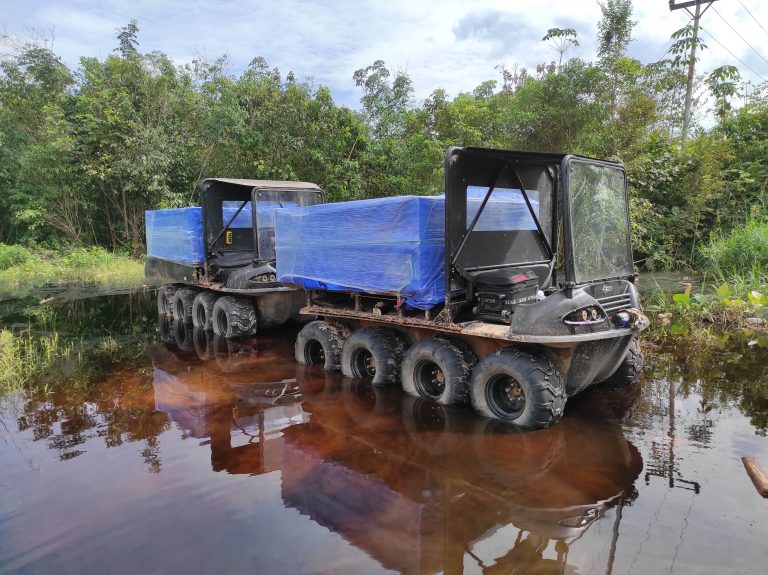 Agile vehicles traversing flooded jungle in Kalimantan